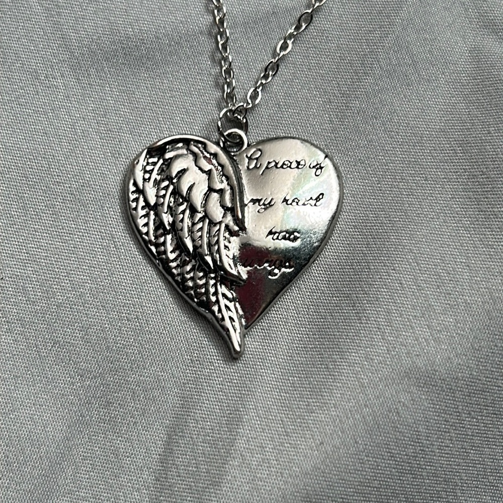 “A Piece Of My Heart Has Wings” Heart Shaped Necklace Color: Silver